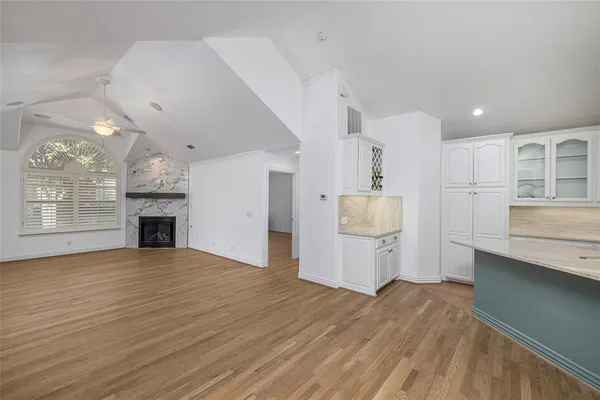 a view of a kitchen with a sink and a fireplace