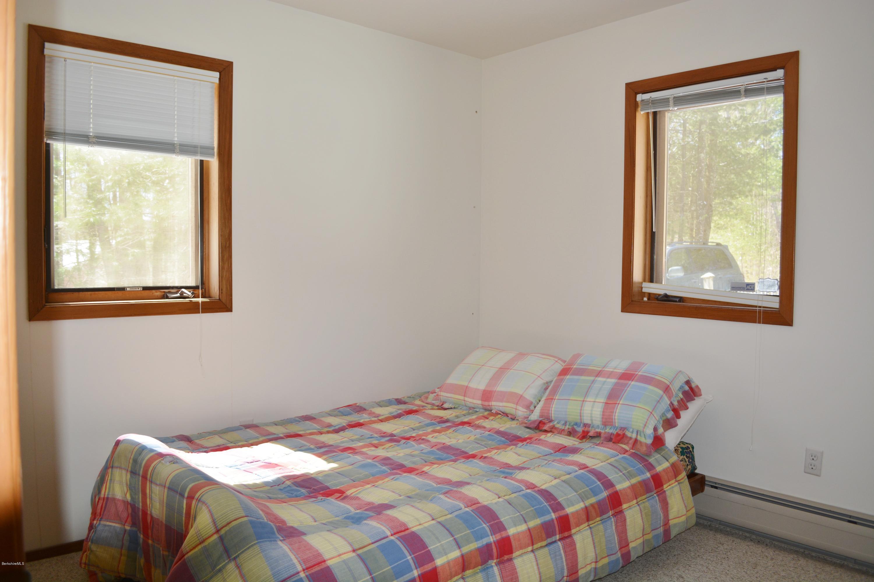 58 Point Road Otis, MA 01029 - Photo 14 of 19 a bedroom with a bed and a window