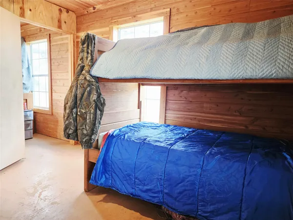 a bed sitting in a room next to a window