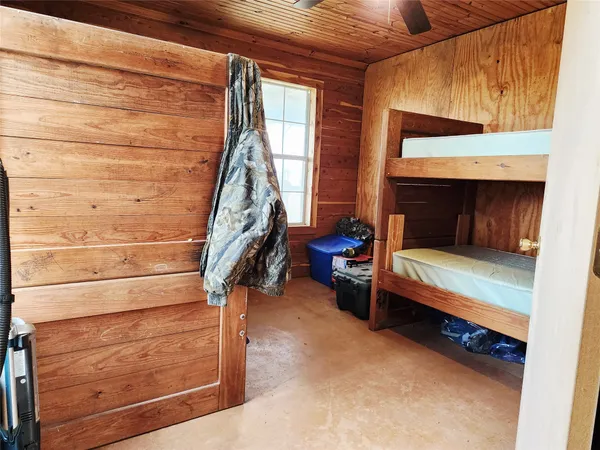 a bed room with a bed and a window