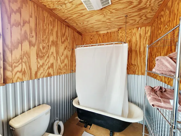 a view of a room with furniture and a window