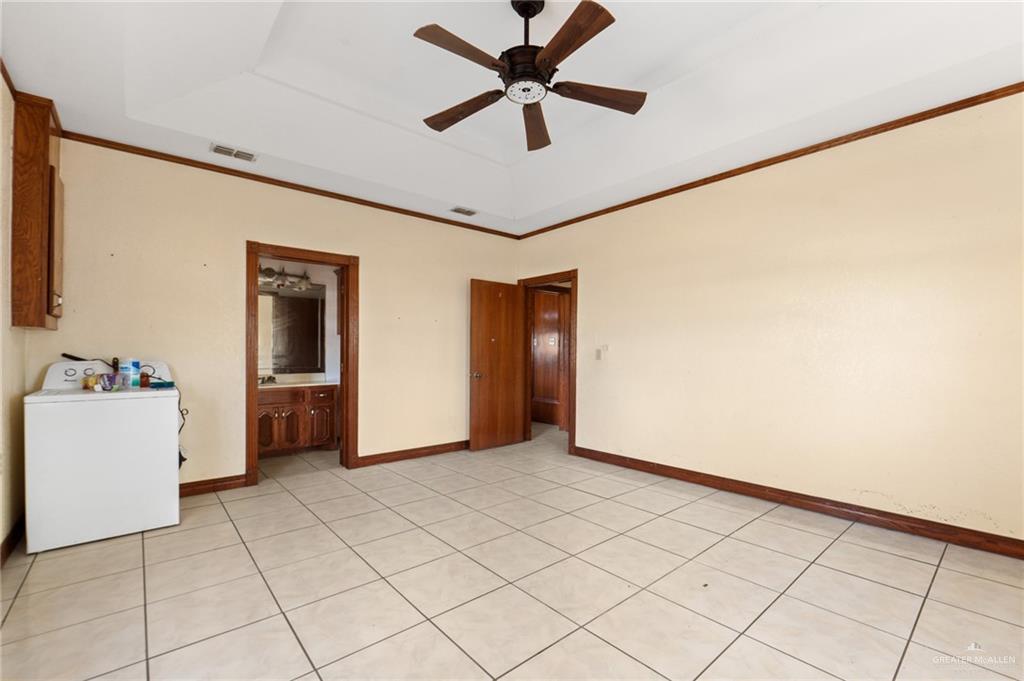 2300 Coby Drive Mission, TX 78574 - Photo 13 of 27 a view of a livingroom with a ceiling fan and staircase
