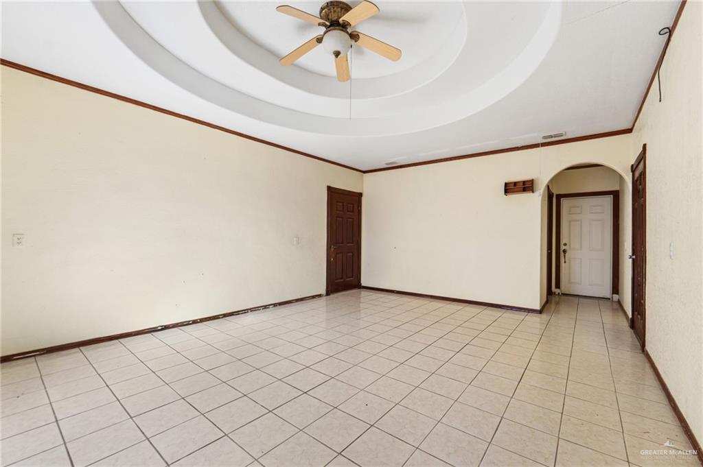 2300 Coby Drive Mission, TX 78574 - Photo 15 of 27 a view of a livingroom with a ceiling fan and entryway