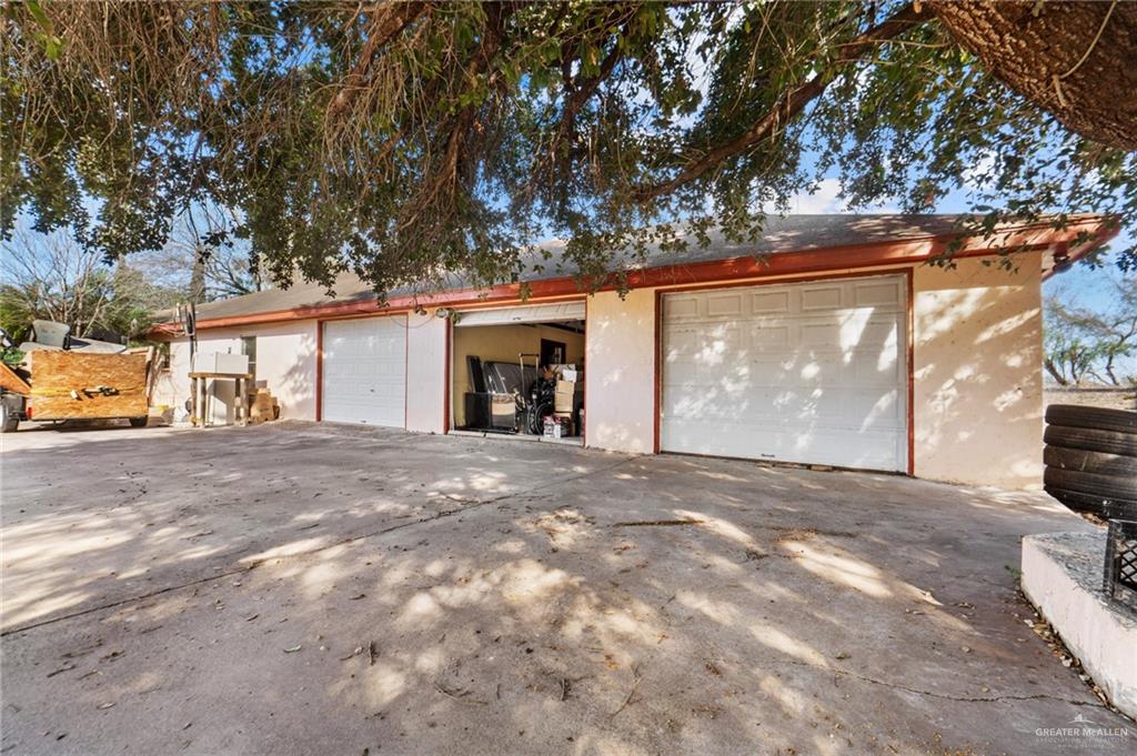 2300 Coby Drive Mission, TX 78574 - Photo 2 of 27 a view of a house with a yard and garage