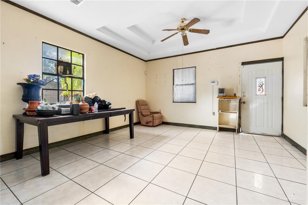 2300 Coby Drive Mission, TX 78574 - Photo 9 of 27 a living room with a baby crib furniture and a window