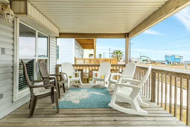 a view of a chairs and table in patio