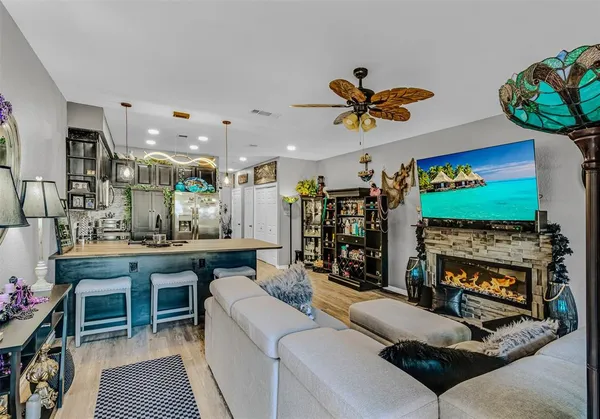 a living room with fireplace furniture and a flat screen tv