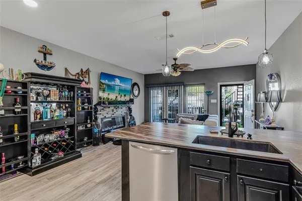 a kitchen with stainless steel appliances granite countertop a stove and cabinets