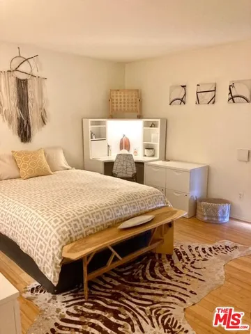 a bedroom with a bed and a table in it