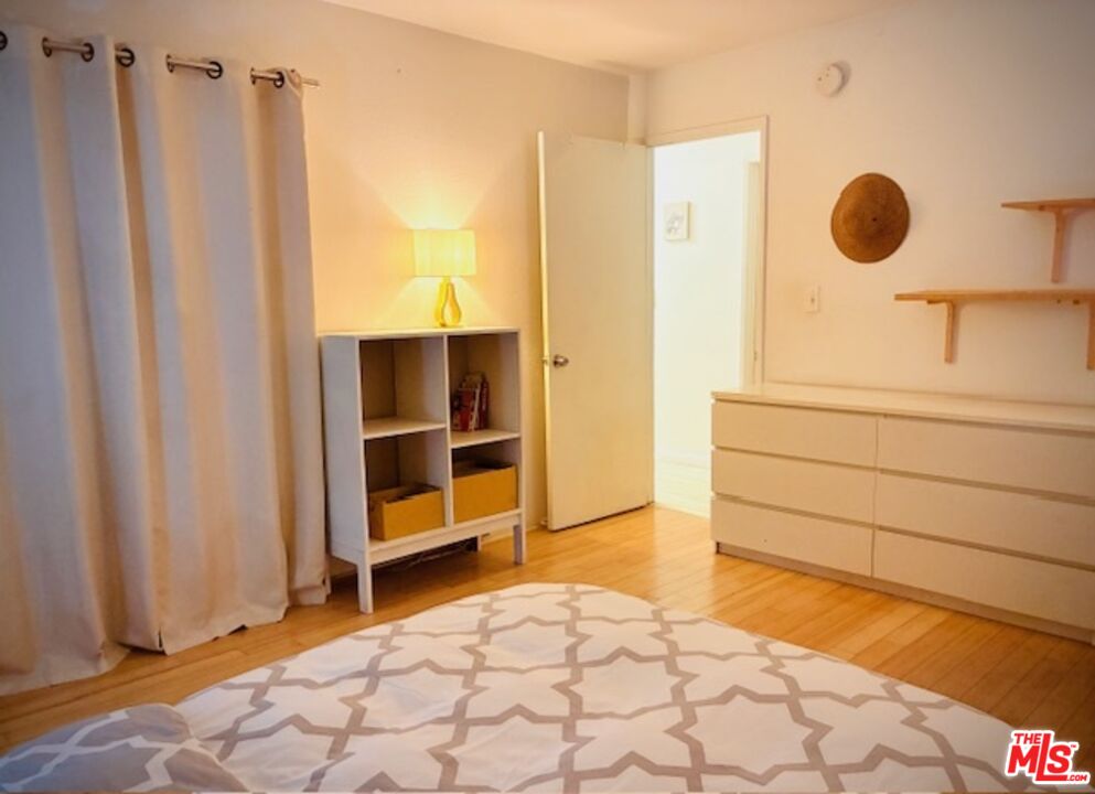 7740 Redlands Street, Unit G1098 Playa del Rey, CA 90293 - Photo 18 of 35 a view of a bedroom with wooden floor and cabinet