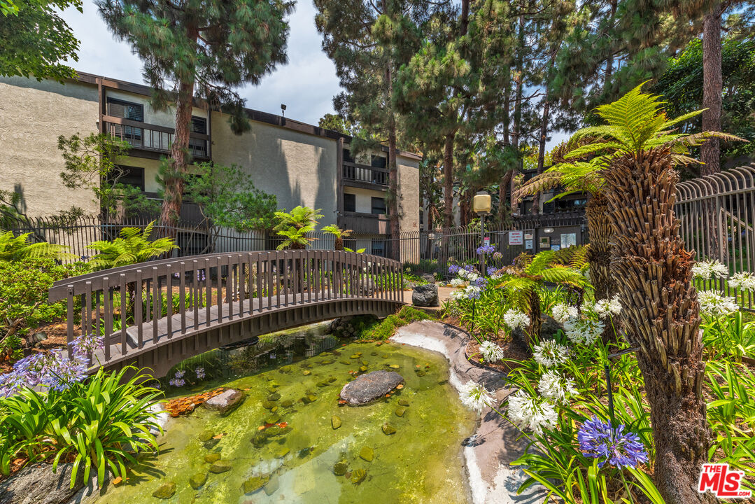 7740 Redlands Street, Unit G1098 Playa del Rey, CA 90293 - Photo 24 of 35 a view of a house with a flower garden