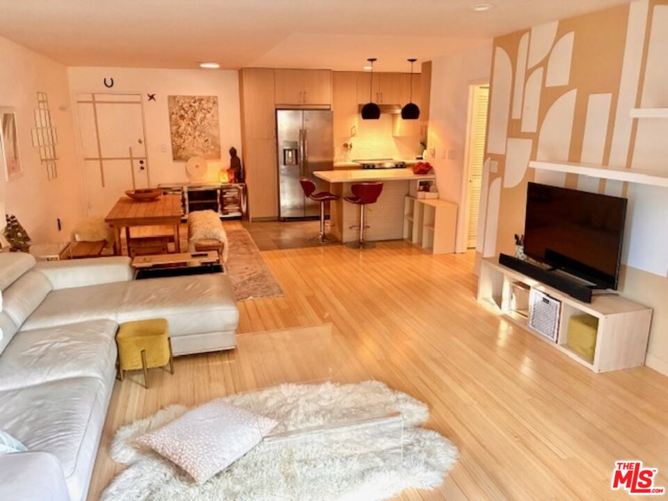 7740 Redlands Street, Unit G1098 Playa del Rey, CA 90293 - Photo 7 of 35 a living room with furniture and a flat screen tv