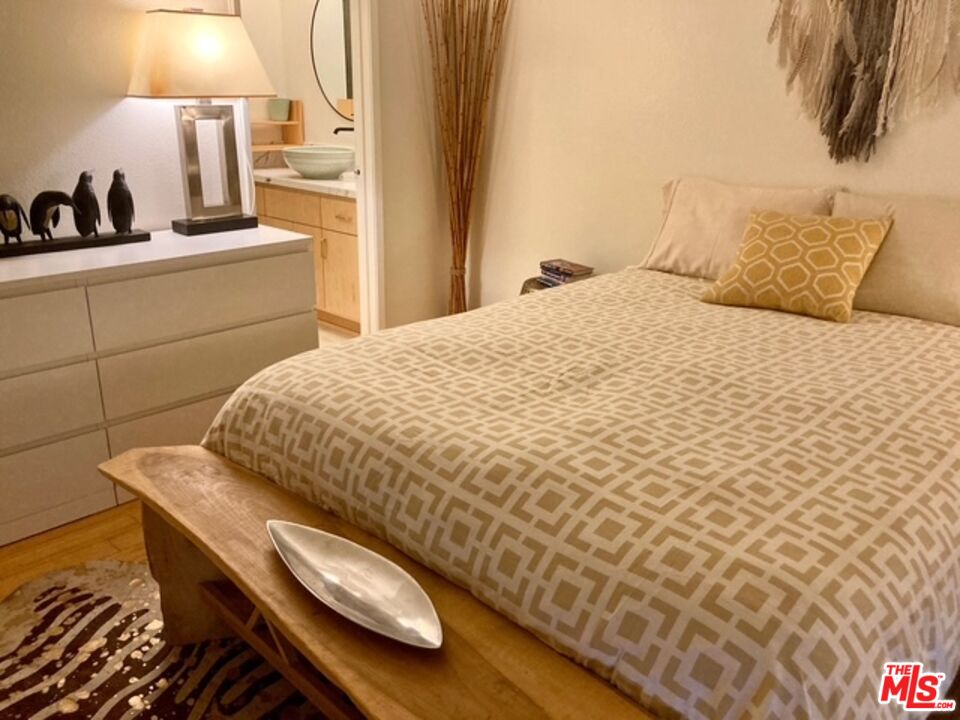 7740 Redlands Street, Unit G1098 Playa del Rey, CA 90293 - Photo 10 of 35 a bedroom with a bed and a lamp
