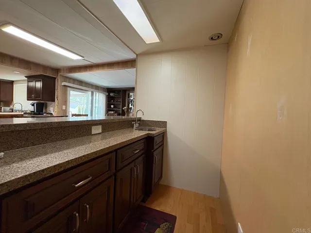 a kitchen with sink and cabinets