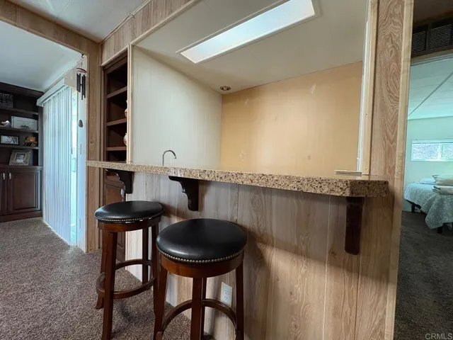 a kitchen with a table and chairs in it