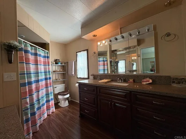 a kitchen with a sink and wooden cabinets