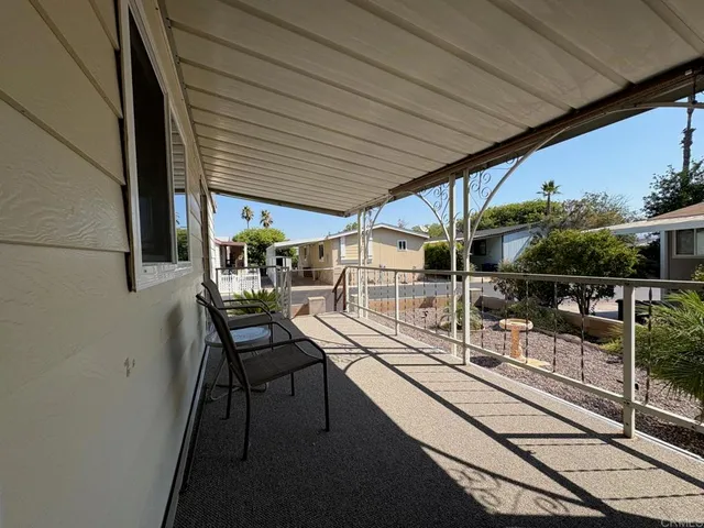 a balcony with furniture and window