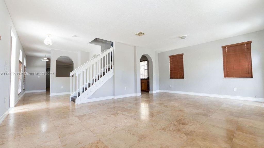 13962 Southwest 278th Street Homestead, FL 33032 - Photo 15 of 45 a view of an entryway with staircase