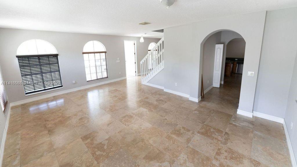 13962 Southwest 278th Street Homestead, FL 33032 - Photo 16 of 45 wooden floor in a room with a window