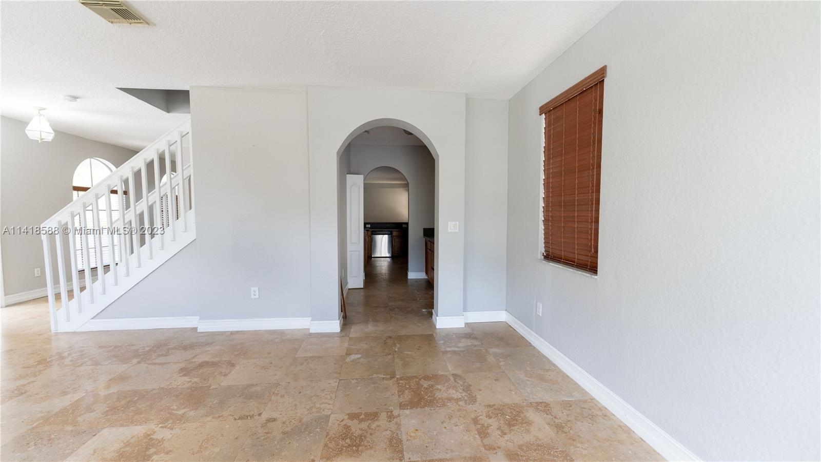 13962 Southwest 278th Street Homestead, FL 33032 - Photo 17 of 45 a view of a hallway view with staircase
