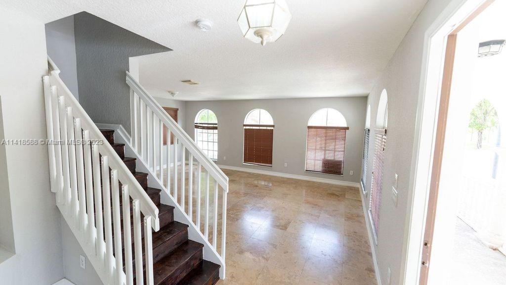 13962 Southwest 278th Street Homestead, FL 33032 - Photo 18 of 45 a view of entryway and hall with wooden floor