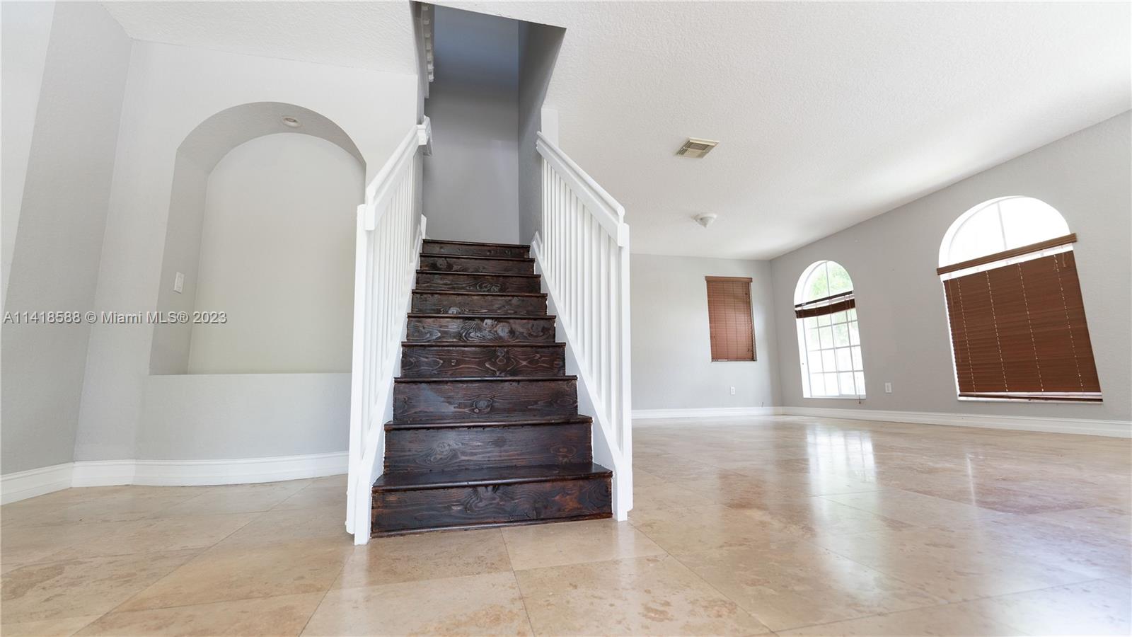 13962 Southwest 278th Street Homestead, FL 33032 - Photo 19 of 45 a view of entryway and hall with wooden floor