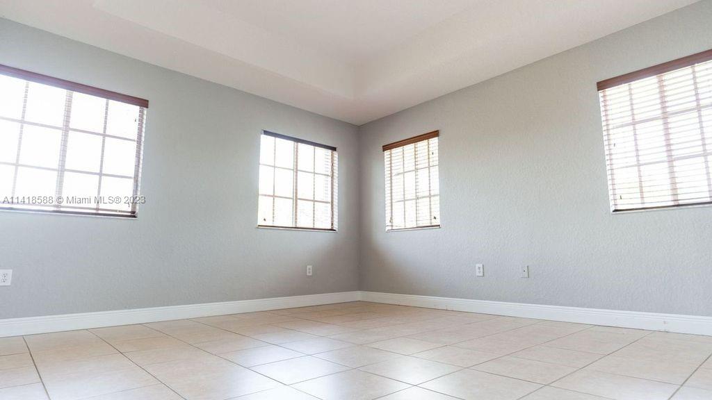 13962 Southwest 278th Street Homestead, FL 33032 - Photo 22 of 45 an empty room with windows