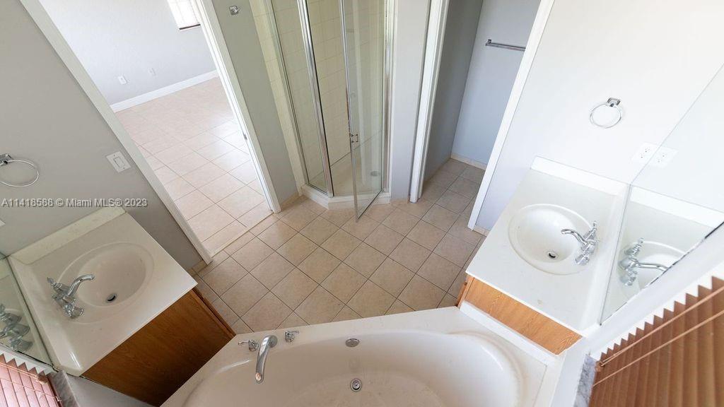13962 Southwest 278th Street Homestead, FL 33032 - Photo 24 of 45 a living room with furniture and a wooden floor