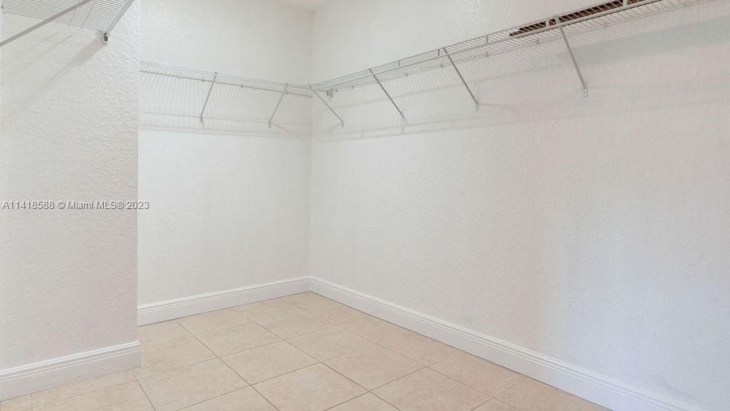 13962 Southwest 278th Street Homestead, FL 33032 - Photo 27 of 45 a view of a room with racks on the wall