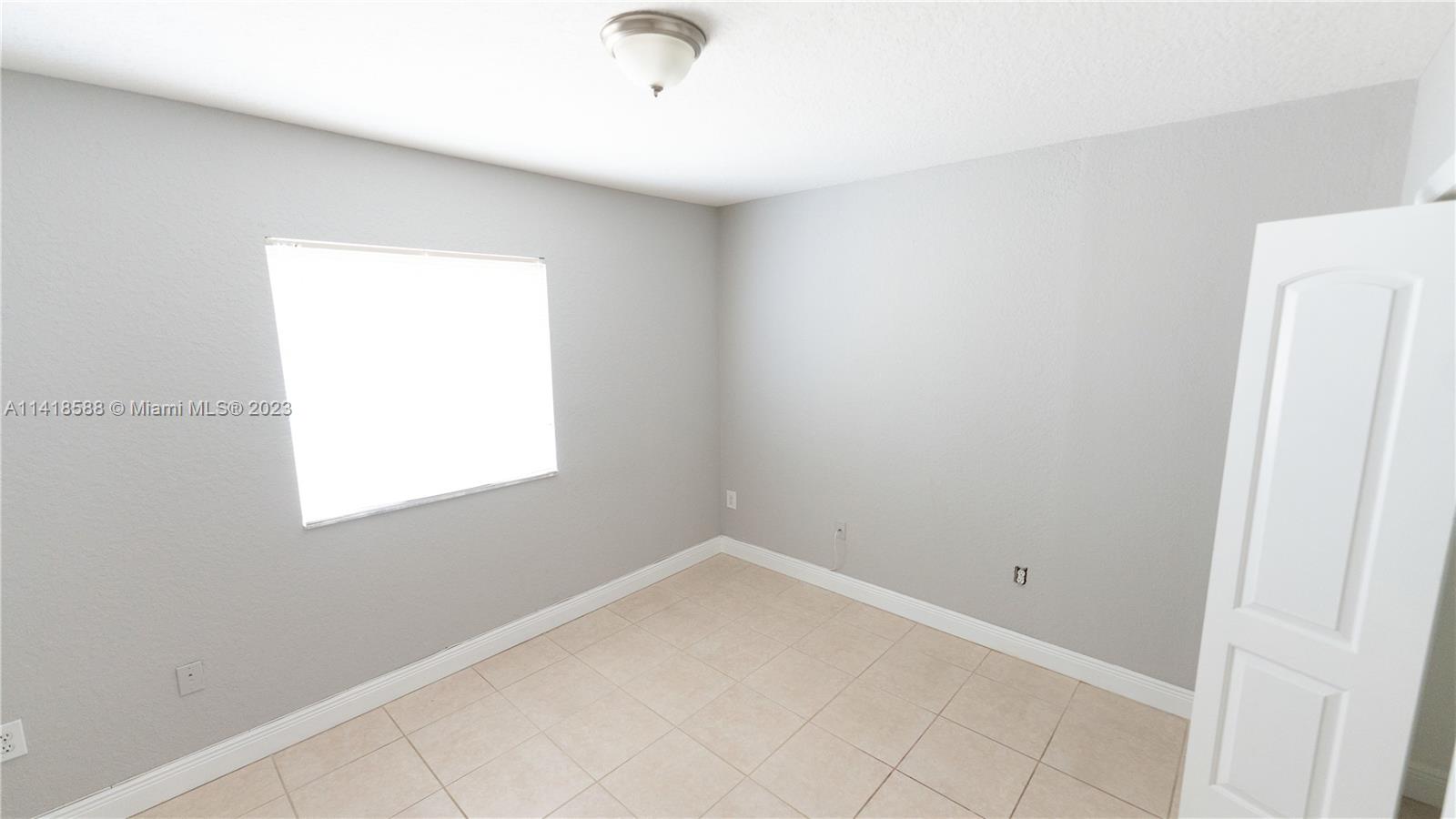 13962 Southwest 278th Street Homestead, FL 33032 - Photo 28 of 45 an empty room with a window