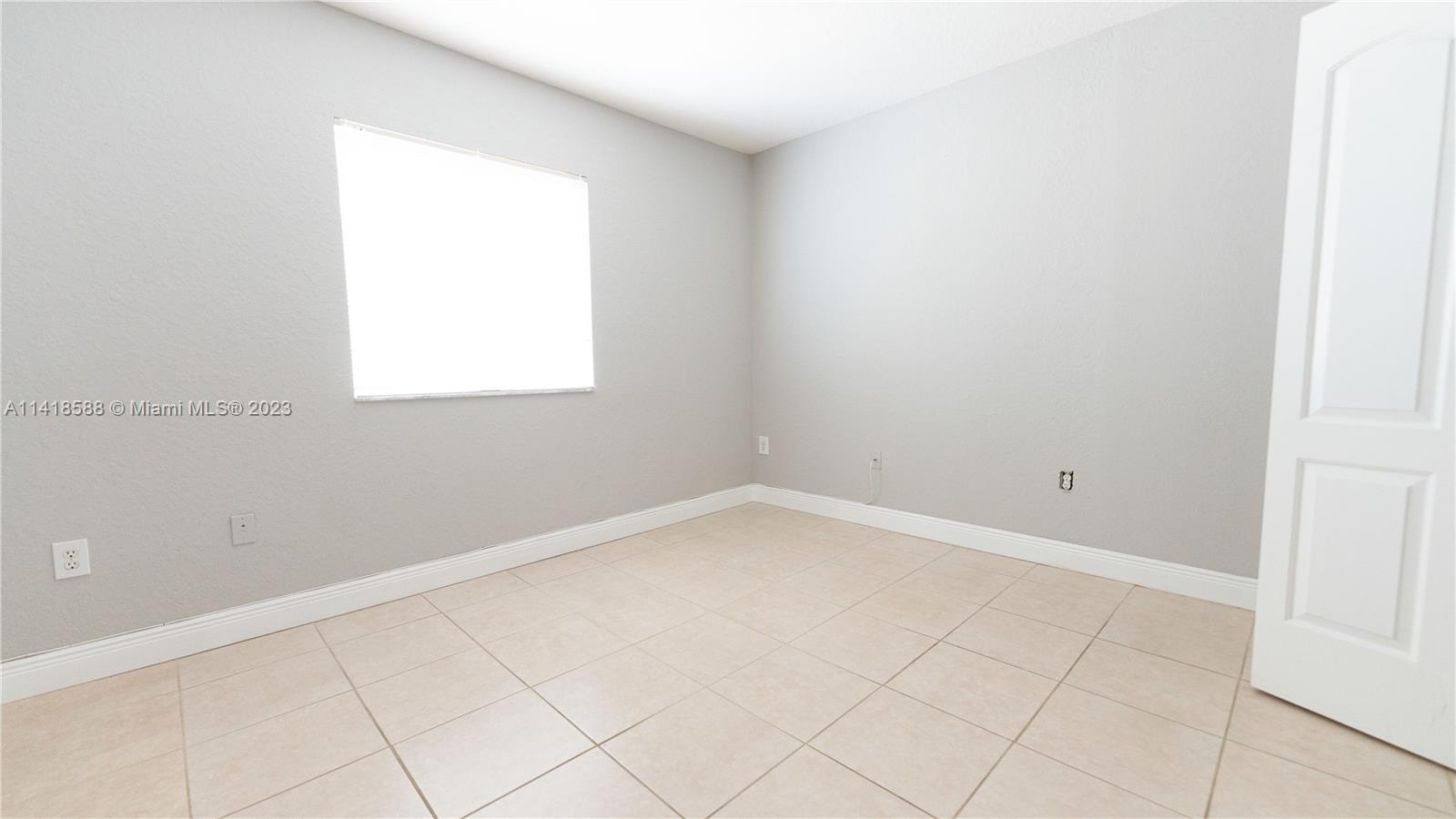 13962 Southwest 278th Street Homestead, FL 33032 - Photo 30 of 45 an empty room with a window
