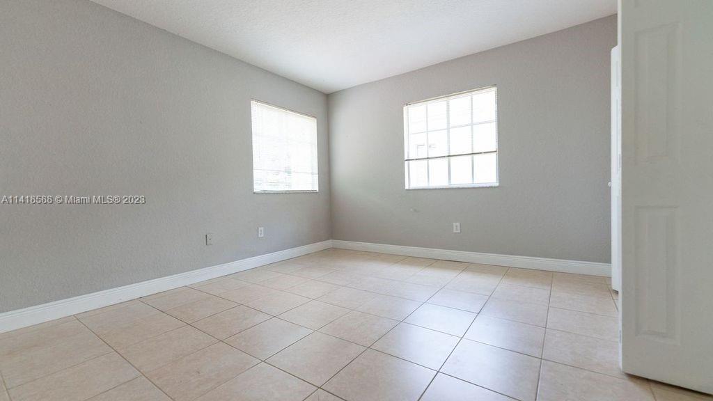 13962 Southwest 278th Street Homestead, FL 33032 - Photo 31 of 45 an empty room with windows
