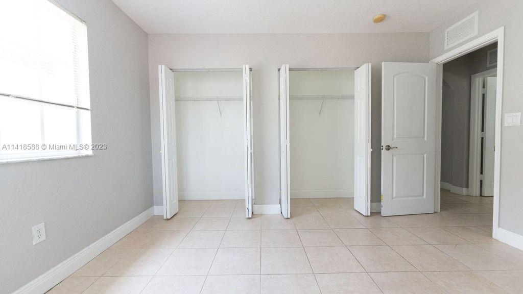 13962 Southwest 278th Street Homestead, FL 33032 - Photo 32 of 45 a view of an empty room with window