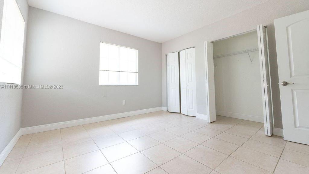 13962 Southwest 278th Street Homestead, FL 33032 - Photo 33 of 45 an empty room with windows