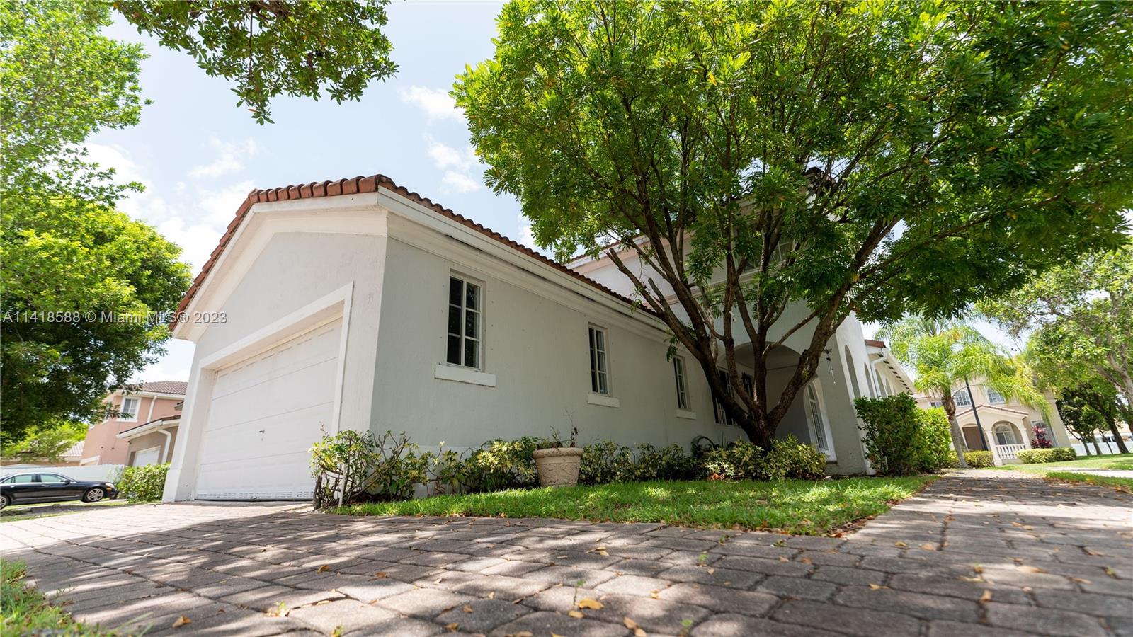 13962 Southwest 278th Street Homestead, FL 33032 - Photo 4 of 45 a front view of a house with garden
