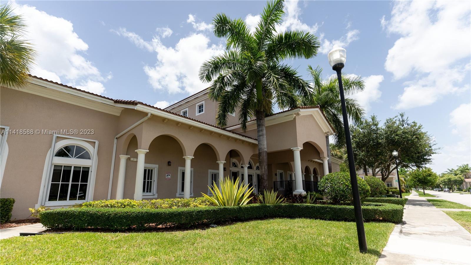 13962 Southwest 278th Street Homestead, FL 33032 - Photo 41 of 45 a front view of a house with garden