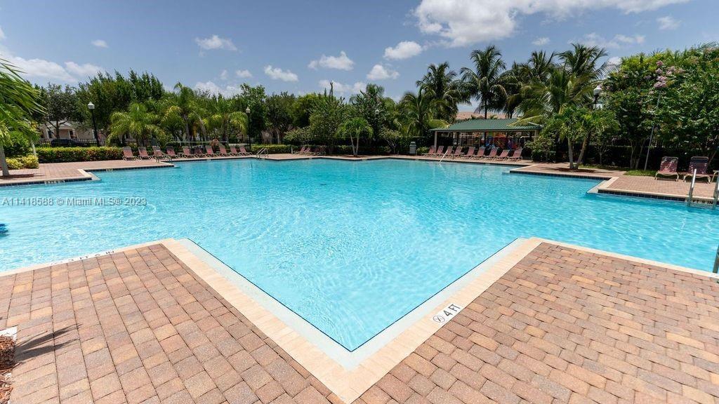 13962 Southwest 278th Street Homestead, FL 33032 - Photo 44 of 45 a view of a swimming pool with a patio and a yard