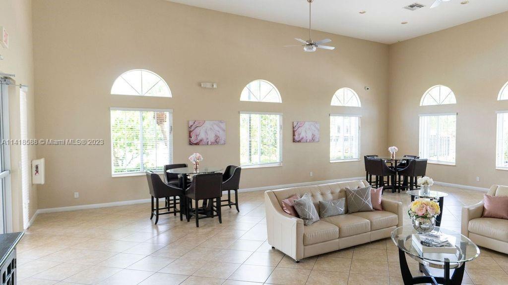 13962 Southwest 278th Street Homestead, FL 33032 - Photo 45 of 45 a living room with furniture chandelier and a large window