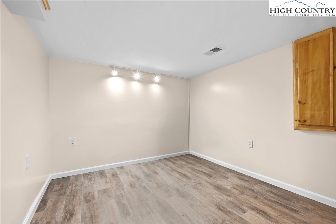 17 Elderberry Loop Newland, NC 28657 - Photo 29 of 47 a view of empty room with wooden floor and fan