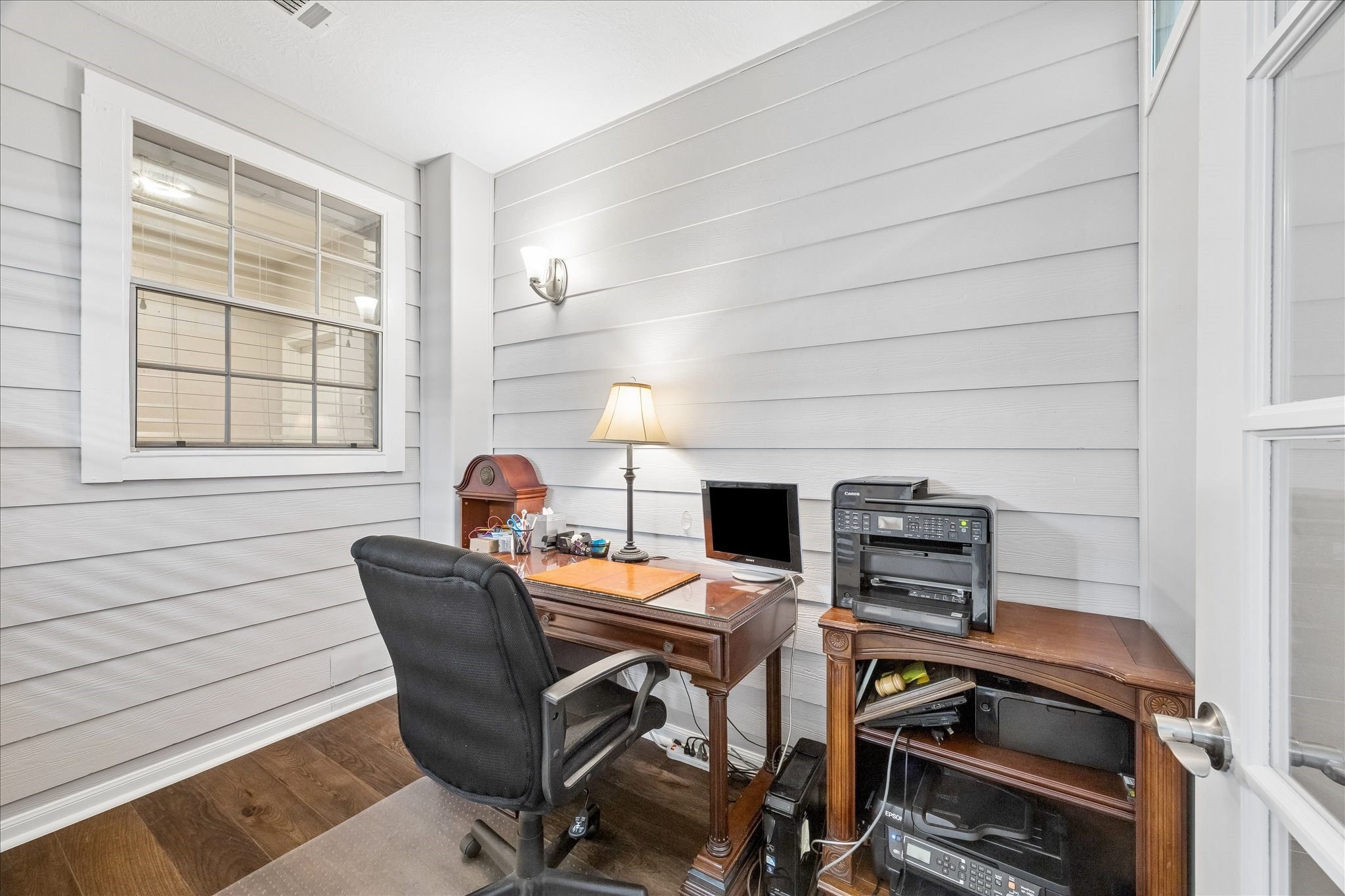 12423 Rutgers Park Court Houston, TX 77058 - Photo 10 of 29 a workspace with a desk chair and painted walls