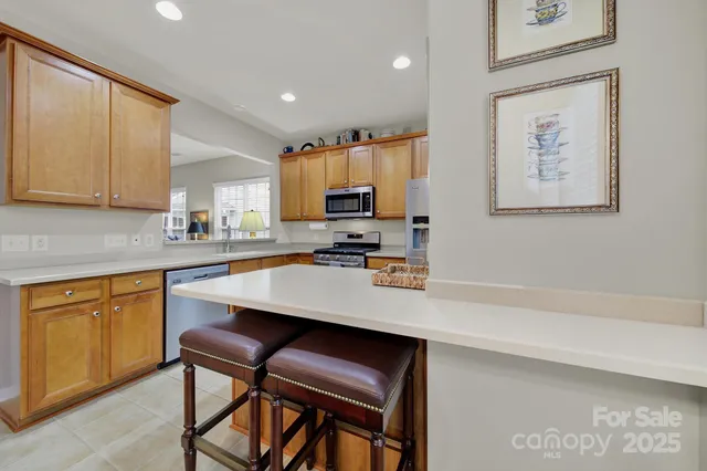 a kitchen with a sink cabinets and window