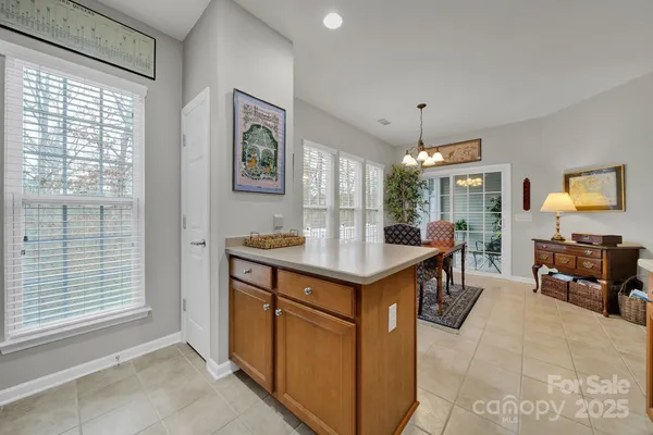 a kitchen with sink and refrigerator
