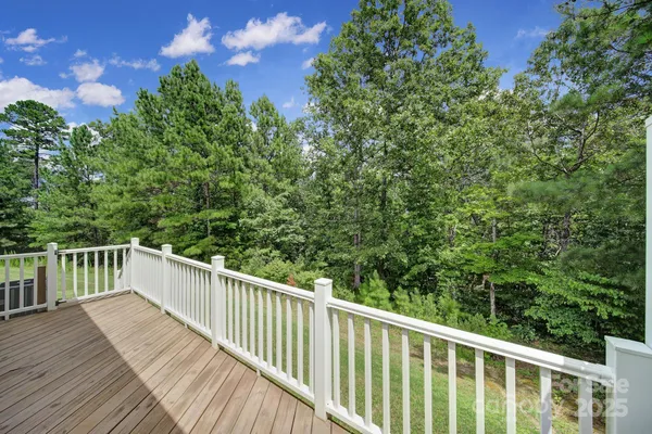 a view of a balcony with wooden floor