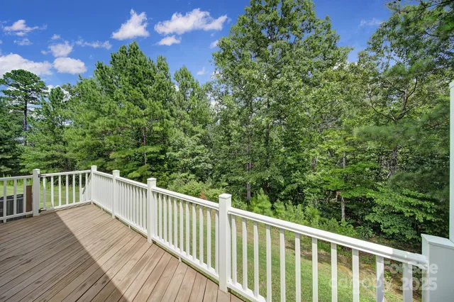 a view of a balcony with wooden floor