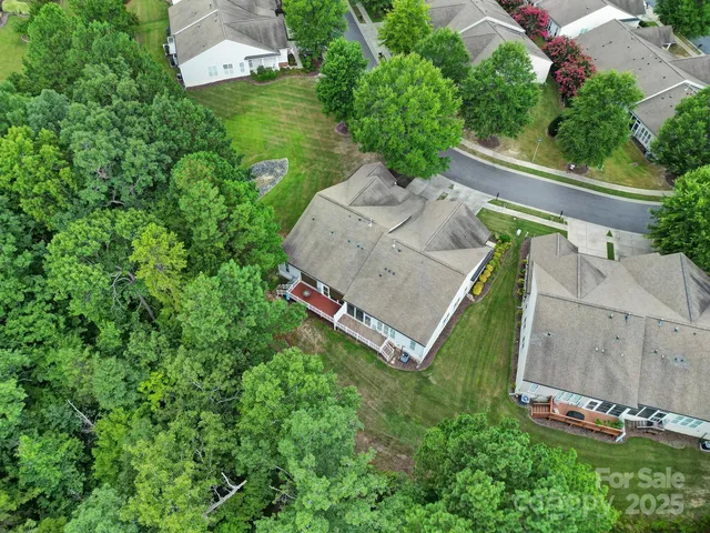 an aerial view of a house with a garden