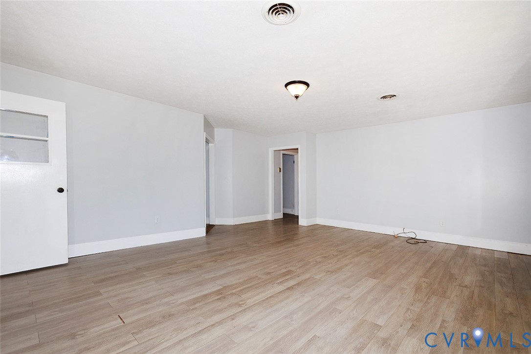 9903 Boze Road Ford, VA 23850 - Photo 6 of 45 a view of an empty room with wooden floor