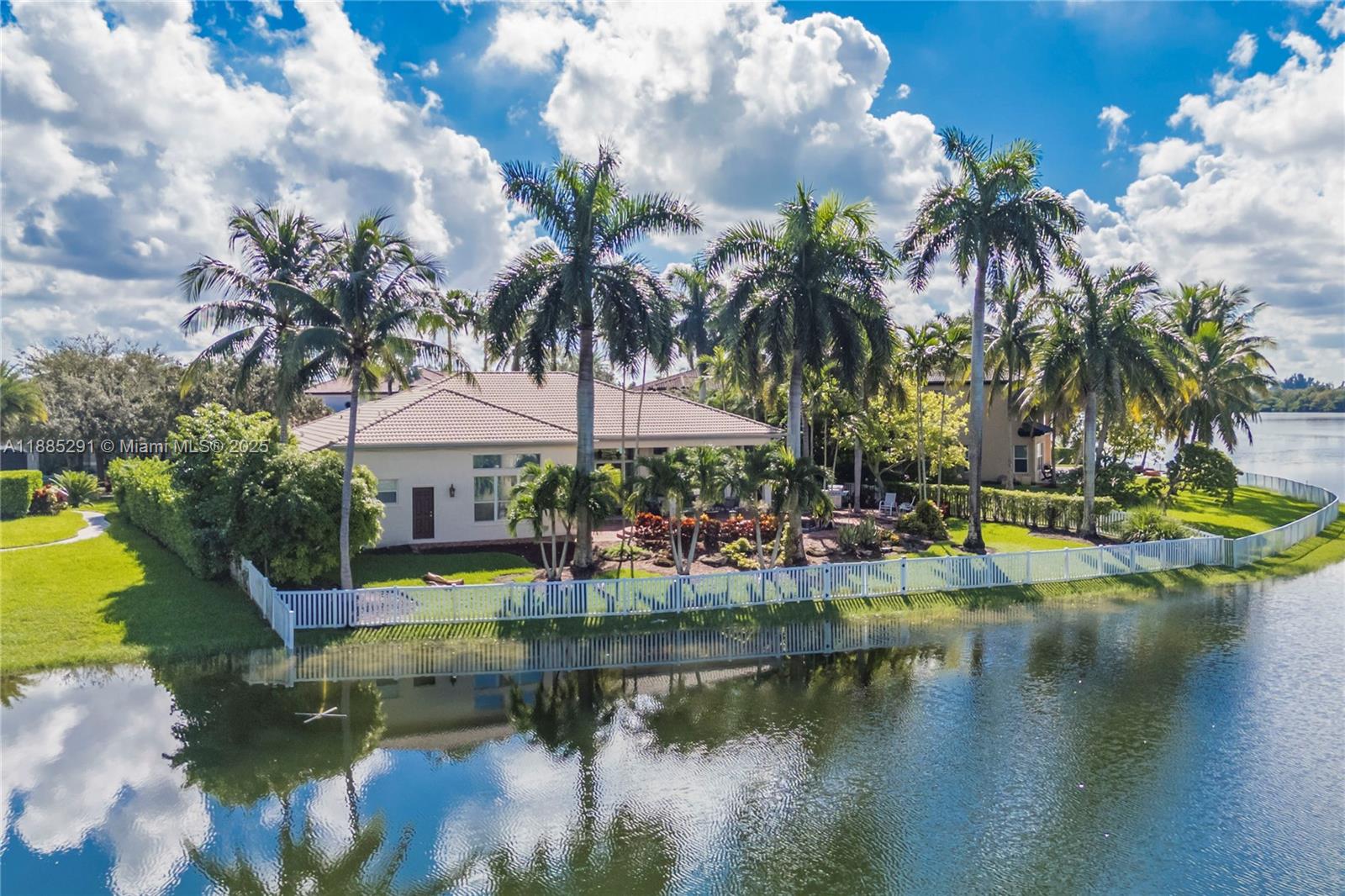 a view of swimming pool with outdoor seating and lake view
