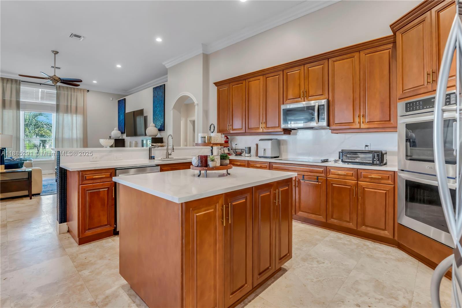 4166 Southwest 190th Avenue Miramar, FL 33029 - Photo 11 of 70 a kitchen with stainless steel appliances granite countertop a sink stove and refrigerator