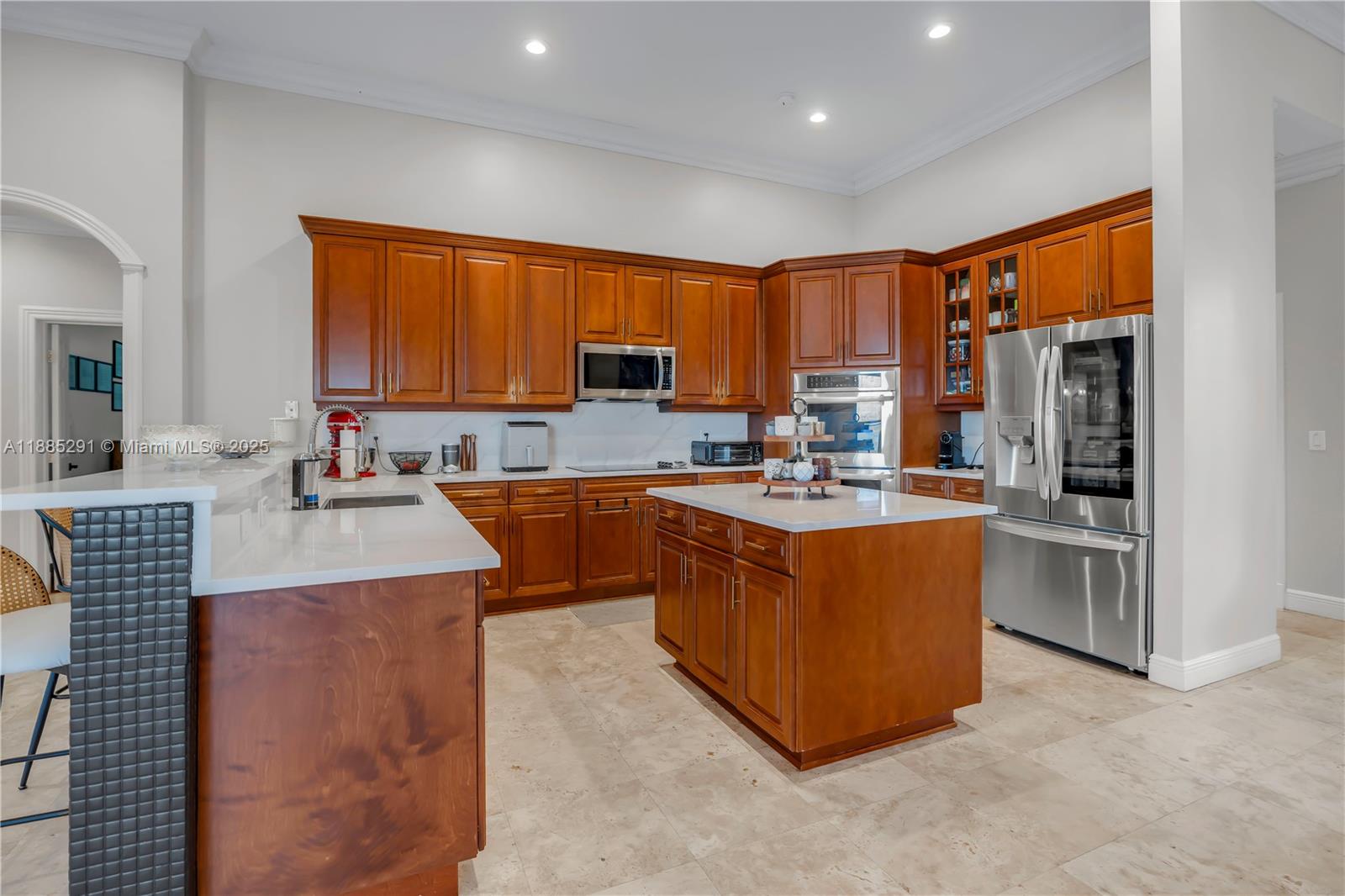 4166 Southwest 190th Avenue Miramar, FL 33029 - Photo 13 of 70 a kitchen with stainless steel appliances granite countertop a stove top oven a sink dishwasher and cabinets with wooden floor