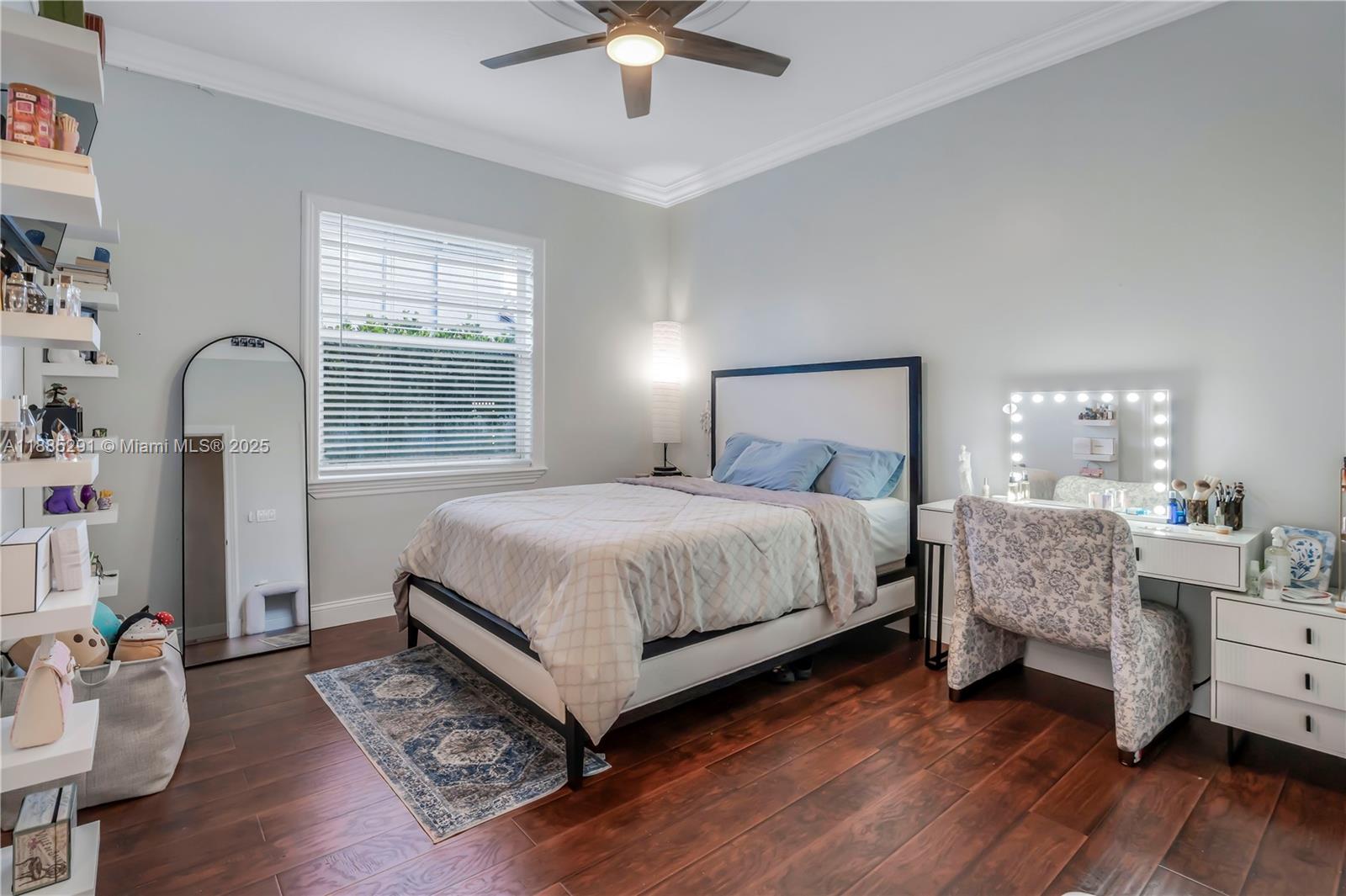 4166 Southwest 190th Avenue Miramar, FL 33029 - Photo 17 of 70 a bedroom with a bed wooden floor and window